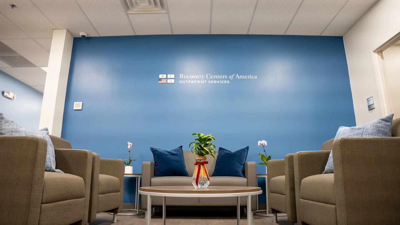 comfortable sofa and branded wall