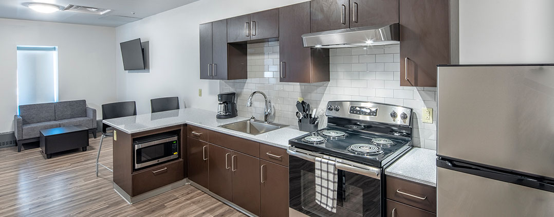 Modern shared kitchen and living space at Helio Health Elements