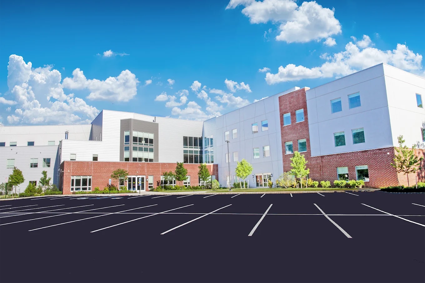 Large treatment facility exterior and parking area