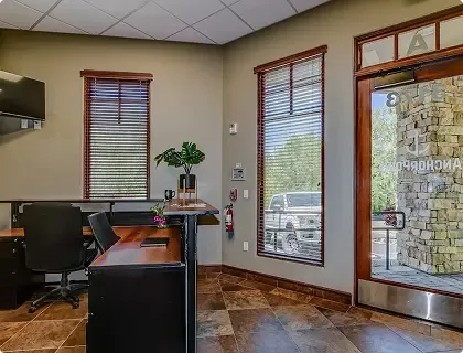 Reception area with front desk and entrance