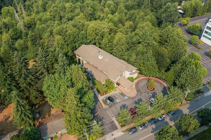 Aerial view of rehab campus surrounded by trees