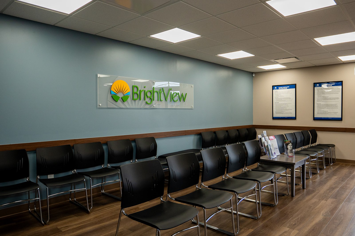 Waiting room with rows of chairs and BrightView sign