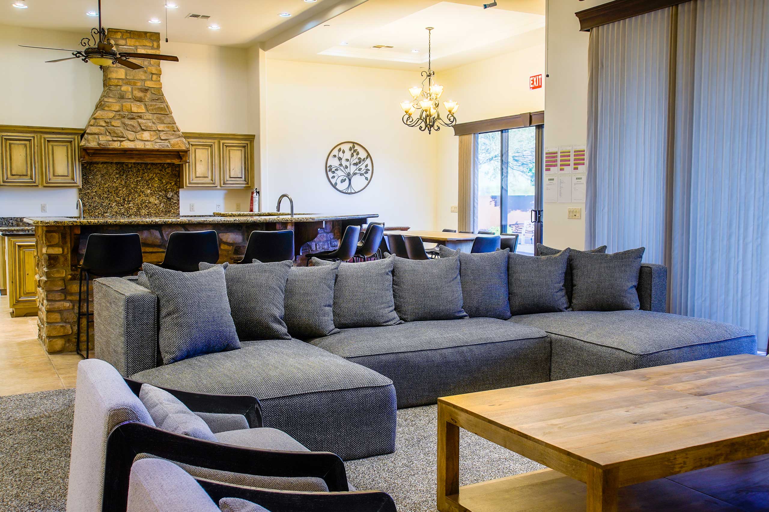 Comfortable living room with couches and kitchen in background