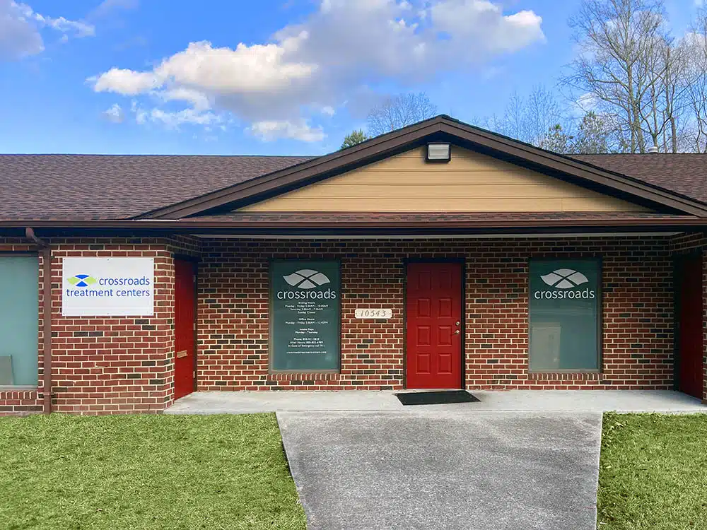 Brick exterior of treatment center with red door entrance