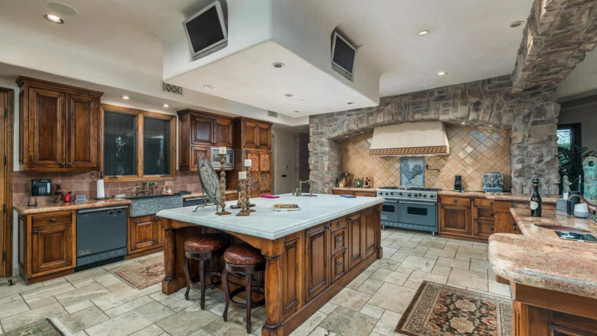 Luxury kitchen with island and stone arch