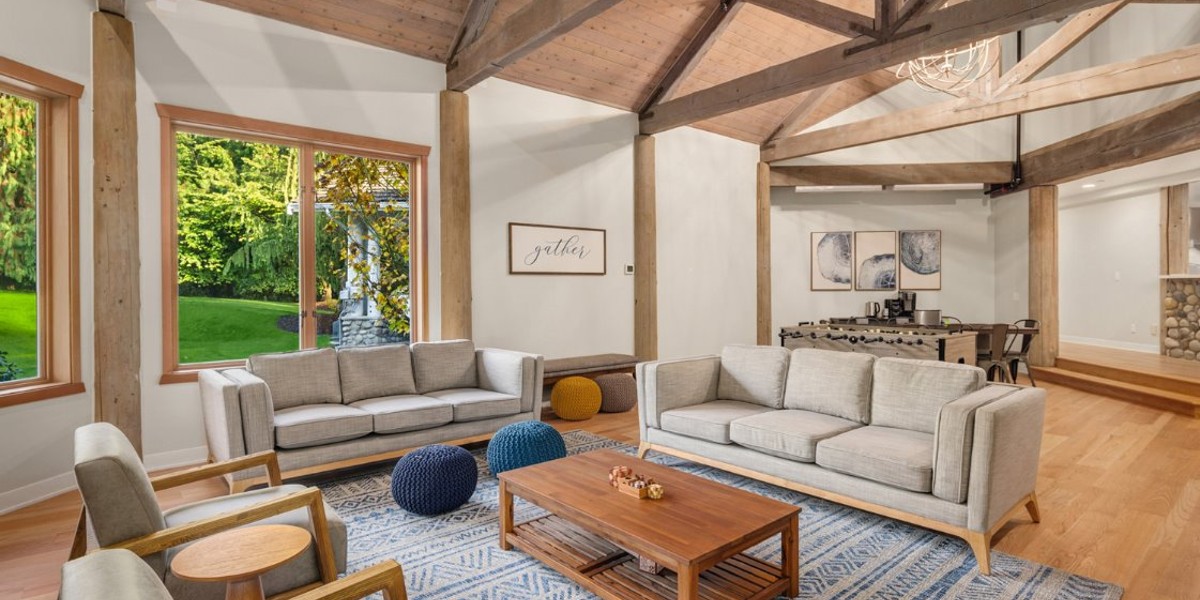 Spacious living room with sofas and wooden beams