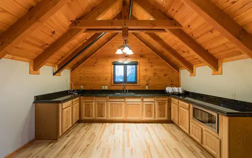 Spacious kitchen with wood cabinetry and countertops