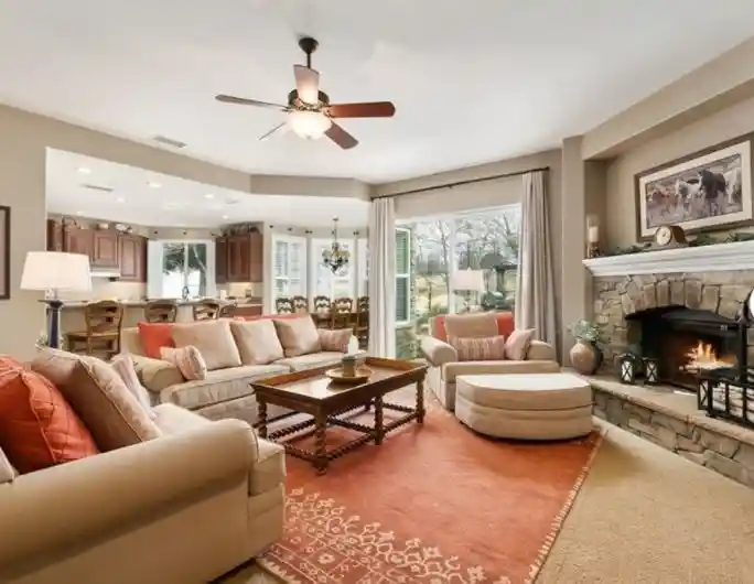 Warm living room with fireplace and comfortable seating.