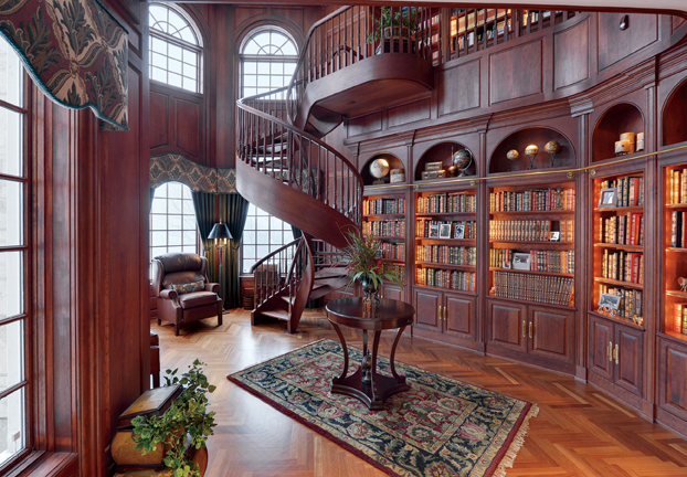 Elegant wood-paneled library with spiral staircase