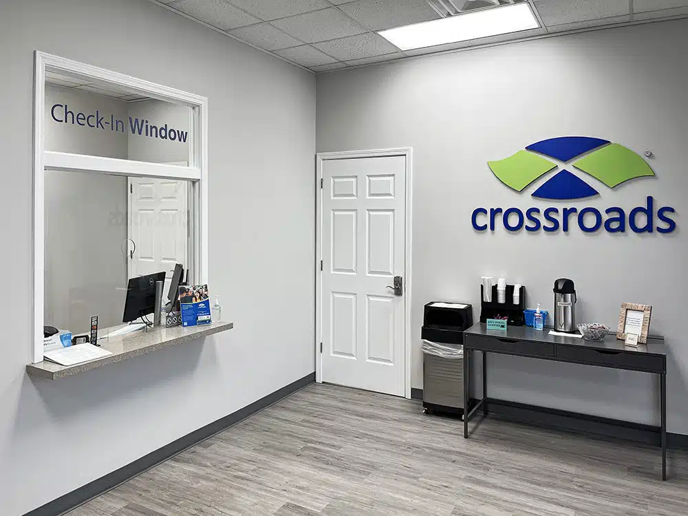 Check-in window and reception desk with Crossroads logo