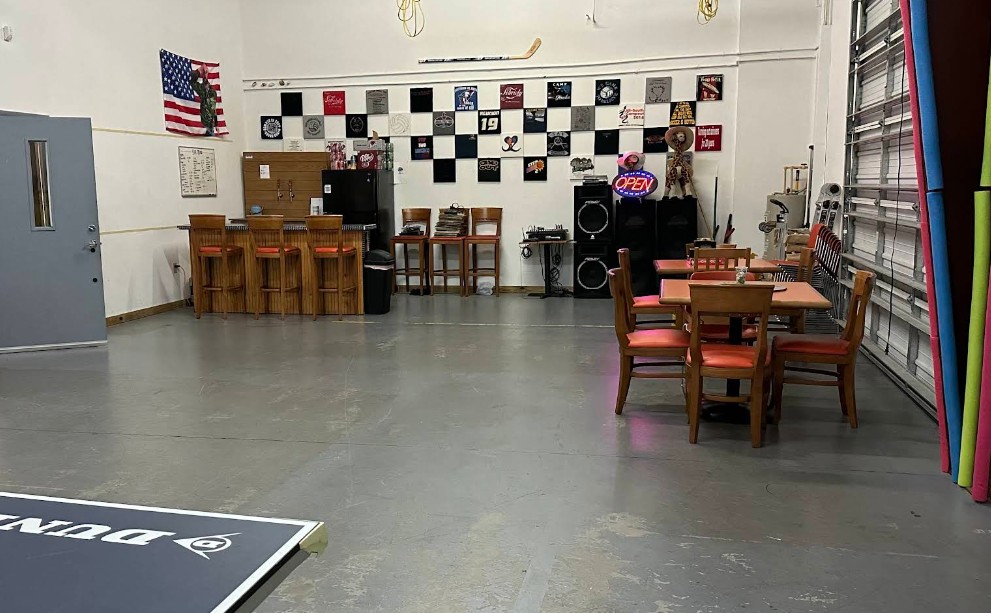 Recreation room with games, tables, and seating