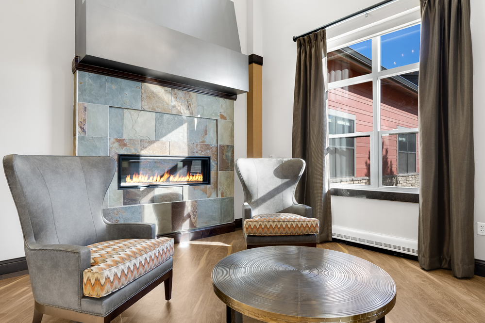 Cozy seating area beside a modern indoor fireplace