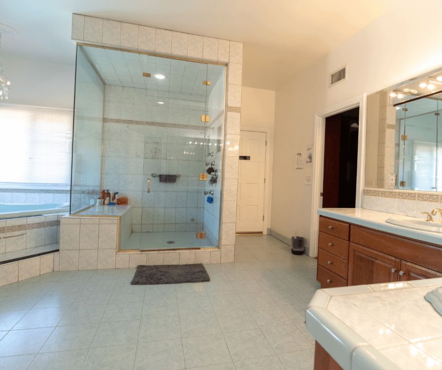 Bathroom with glass walk-in shower and double vanity