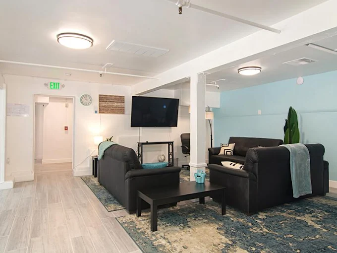 Comfortable lounge with sofas and large television