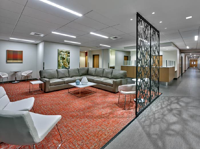 Large waiting area with reception and offices in view.