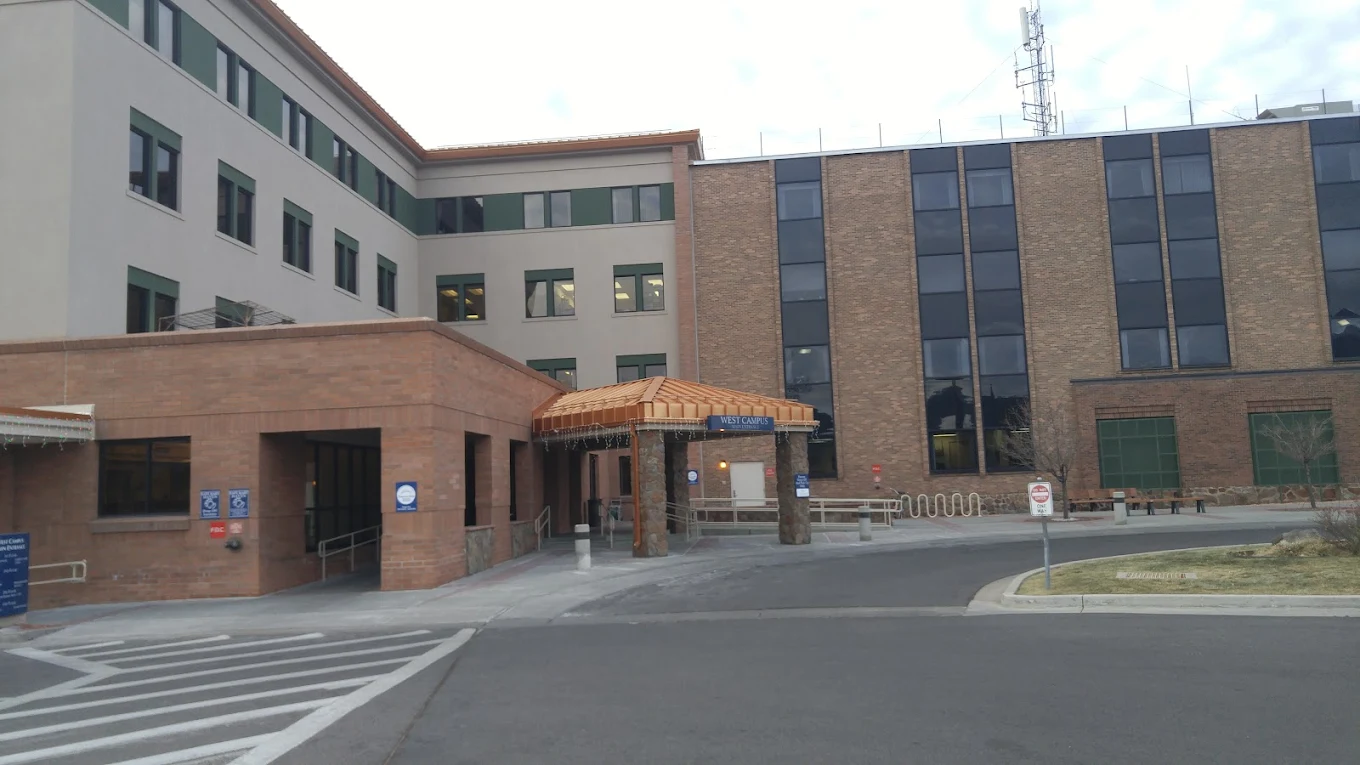 Exterior view of hospital entrance with canopy and signage