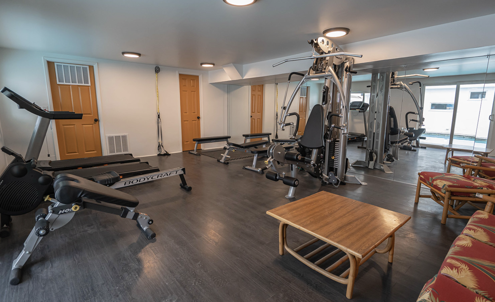 Fitness room with treadmill and weight equipment