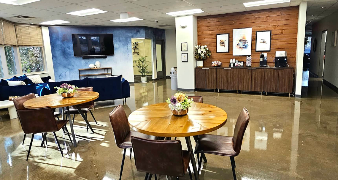 Lounge with dining tables and coffee station